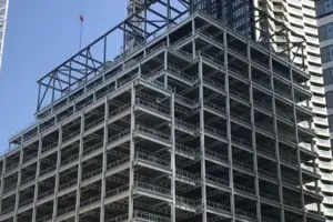 Multi-story steel building skeleton welded with shear weld studs for concrete slab composite decking.