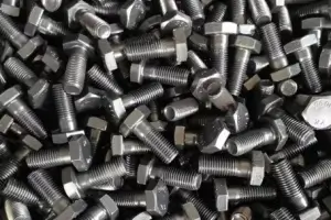 Bulk finished threaded weld studs after surface treatment and anti-corrosion coating.