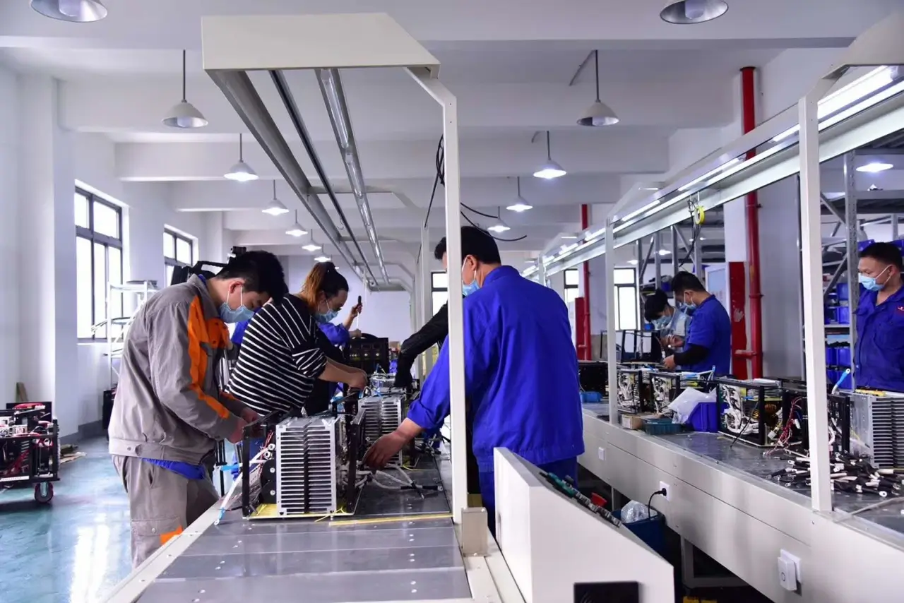 Skilled Engineers Assembling Stud Welding Machines - Factory Quality Control